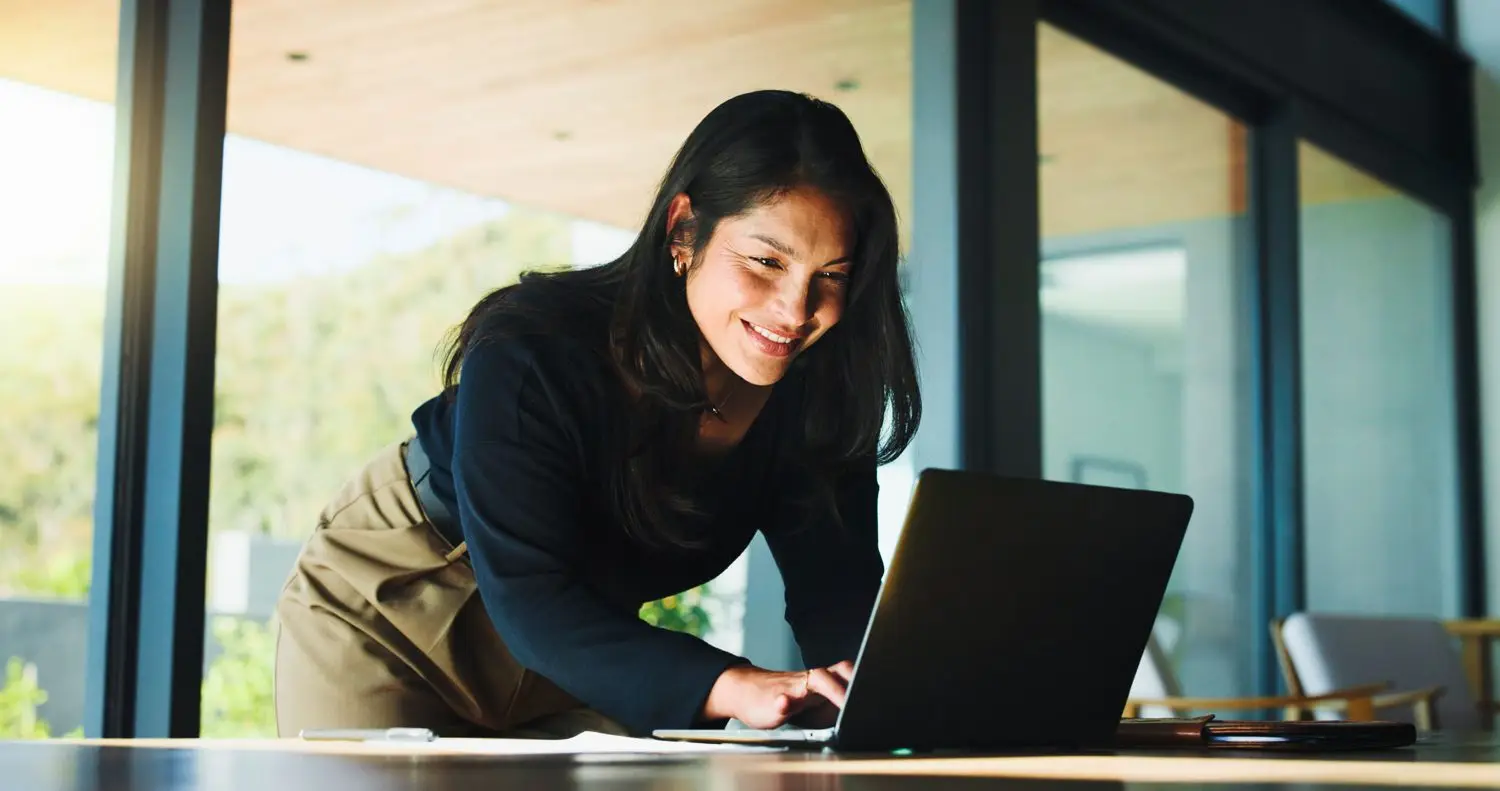 A Probate Realtor specialist working attentively at a laptop